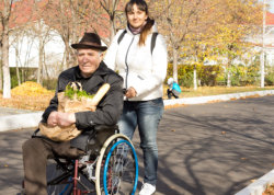 Caregiver assisting the elderly man