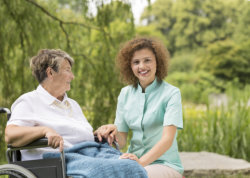 Smiling Caregiver and elderly woman